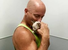 Peter Cohen kissing one of his cats